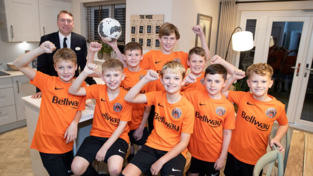 Bellway-sales-advisor-Josh-with-players-from-Euxton-Villa-at-Euxton-Heights-SMALLER