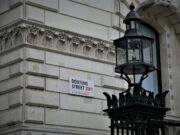 Andy Burnham Unveils ‘No 10 North’ Initiative to Transform Power Dynamics Across the UK photo of black metal framed glass street post near gray concrete building during daytime