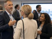 generic conference, blurred out people, slightly abstract, candid,