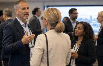 generic conference, blurred out people, slightly abstract, candid,